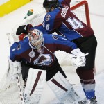 Colorado Avalanche defenseman Brandon Gormley, right, skates into goalie Semyon Varlamov, of Russia, after he stopped a shot off the stick of an Arizona Coyotes player in the second period of an NHL hockey game Sunday, Dec. 27, 2015, in Denver. (AP Photo/David Zalubowski)