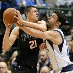 Phoenix Suns center Alex Len, left, of Ukraine attempts to get to the basket as Dallas Mavericks center Zaza Pachulia, right, of Georgia defends in the first half of an NBA basketball game, Monday, Dec. 14, 2015, in Dallas. (AP Photo/Tony Gutierrez)