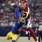 St. Louis Rams cornerback Janoris Jenkins, bottom, breaks up a pass intended for Arizona Cardinals wide receiver Michael Floyd during the second quarter of an NFL football game on Sunday, Dec. 6, 2015, in St. Louis. (AP Photo/L.G. Patterson)
