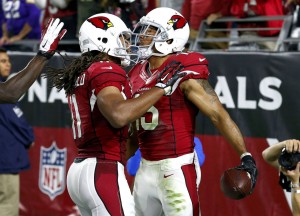 Arizona Cardinals wide receiver Michael Floyd (15) celebrates after scoring a touchdown against the Minnesota Vikings with Larry Fitzgerald (11) during the second half of an NFL football game, Thursday, Dec. 10, 2015, in Glendale, Ariz. (AP Photo/Ross D. Franklin)