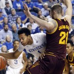 Kentucky's Skal Labissiere, left, looks for an opening on Arizona State's Eric Jacobsen (21) during the first half of an NCAA college basketball game Saturday, Dec. 12, 2015, in Lexington, Ky.  (AP Photo/James Crisp)