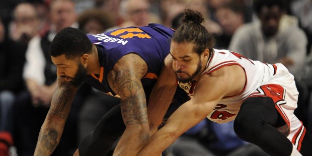 Chicago Bulls' Joakim Noah (13), battles Phoenix Suns' Markieff Morris (11), for a loose ball durin...