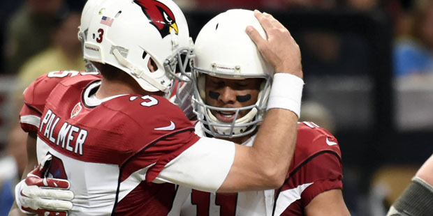 Arizona Cardinals wide receiver Larry Fitzgerald, right, is congratulated by quarterback Carson Pal...