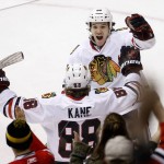 Chicago Blackhawks' Patrick Kane (88) celebrates his goal against the Arizona Coyotes with Andrew Shaw (65) during the second period of an NHL hockey game Tuesday, Dec. 29, 2015, in Glendale, Ariz. (AP Photo/Ross D. Franklin)