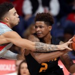 Arizona guard Gabe York (1) forces Long Beach State guard Nick Faust (2) into a turnover during the first half of an NCAA college basketball game Tuesday, Dec. 22, 2015, in Tucson, Aria. (Kelly Presnell/Arizona Daily Star via AP)