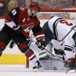 Minnesota Wild's Charlie Coyle (3) arrives to defend a shot by Arizona Coyotes' Mikkel Boedker (89), of Denmark, during the first period of an NHL hockey game Friday, Dec. 11, 2015 in Glendale, Ariz. (AP Photo/Ross D. Franklin)