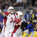 Arizona Cardinals quarterback Carson Palmer throws during the second quarter of an NFL football game against the St. Louis Rams on Sunday, Dec. 6, 2015, in St. Louis. (AP Photo/Tom Gannam)