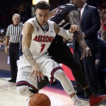 Arizona guard Gabe York (1) steals the ball from Fresno State guard Marvelle Harris during the first half of an NCAA college basketball game, Wednesday, Dec. 9, 2015, in Tucson, Ariz. (AP Photo/Rick Scuteri)