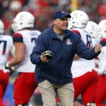 Arizona head coach Rich Rodriguez gives encouragement to his players during a timeout in the second half of the New Mexico Bowl NCAA college football game against New Mexico in Albuquerque, N.M., Saturday, Dec. 19, 2015. Arizona won 45-37. (AP Photo/Andres Leighton)