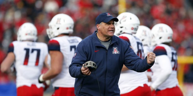 Arizona head coach Rich Rodriguez gives encouragement to his players during a timeout in the second...