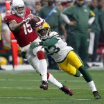 Arizona Cardinals wide receiver Michael Floyd (15) makes a catch as Green Bay Packers cornerback Damarious Randall (23) defends during the first half of an NFL football game, Sunday, Dec. 27, 2015, in Glendale, Ariz. (AP Photo/Rick Scuteri)
