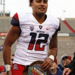 Arizona quarterback Anu Solomon smiles after receiving the Offensive Player of the Game award after the New Mexico Bowl NCAA college football game against New Mexico in Albuquerque, N.M., Saturday, Dec. 19, 2015. Arizona won 45-37. (AP Photo/Andres Leighton)