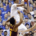 Kentucky's Marcus Lee, top, gets a rebound near Arizona State's Tra Holder during the second half of an NCAA college basketball game Saturday, Dec. 12, 2015, in Lexington, Ky. Kentucky won 72-58. (AP Photo/James Crisp)