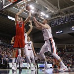 Arizona's Dusan Ristic (14) shoots in front of Gonzaga's Domantas Sabonis (11) and Kyle Wiltjer during the first half of an NCAA college basketball game, Saturday, Dec. 5, 2015, in Spokane, Wash. (AP Photo/Young Kwak)