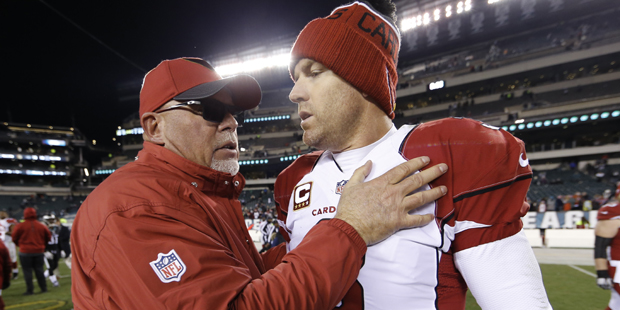 Arizona Cardinals head coach Bruce Arians, left, meets with quarterback Carson Palmer after an NFL ...