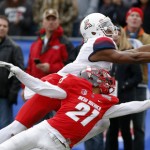 Arizona wide receiver Cayleb Jones,left, comes up short for a catch as he's defended by New Mexico cornerback Donnie Duncan, right, during the second half of the New Mexico Bowl NCAA college football game in Albuquerque, N.M., Saturday, Dec. 19, 2015. Arizona won 45-37. (AP Photo/Andres Leighton)