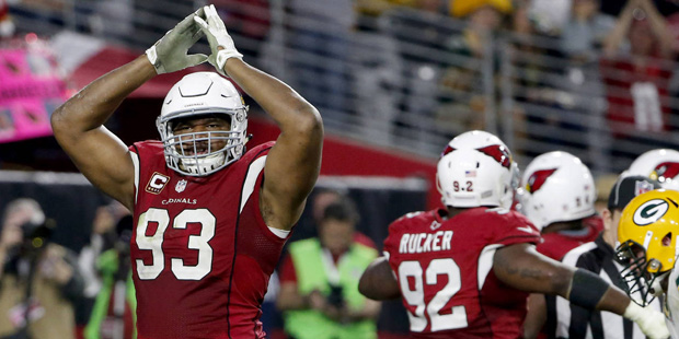 Arizona Cardinals defensive end Calais Campbell (93) signals safety after a sack in the end zone ag...