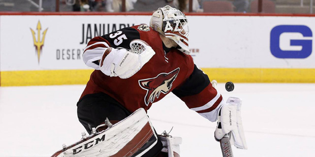Arizona Coyotes' Louis Domingue (35) makes a save against the New York Islanders during the third p...