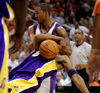 Phoenix Suns' Raja Bell, rear, commits a technical foul on Los Angeles Lakers' Kobe Bryant in the s...