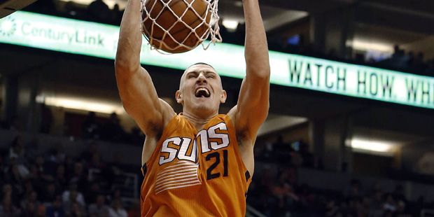Phoenix Suns center Alex Len (21) dunks over New Orleans Pelicans center Omer Asik during the third...