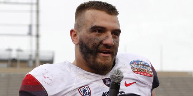 Arizona linebacker Scooby Wright III thanks the support of the crowd while receiving the Defensive ...