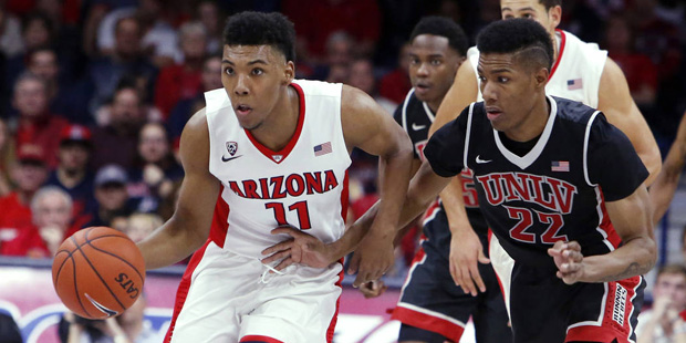 Arizona guard Allonzo Trier (11) drives past UNLV guard Patrick McCaw during the second half of an ...