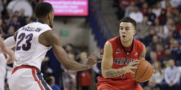 Arizona's Gabe York (1) looks to pass while defended by Gonzaga's Eric McClellan (23) during the se...