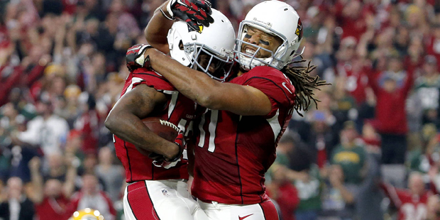 Arizona Cardinals wide receiver John Brown (12) celebrates his touchdown with teammate Larry Fitzge...
