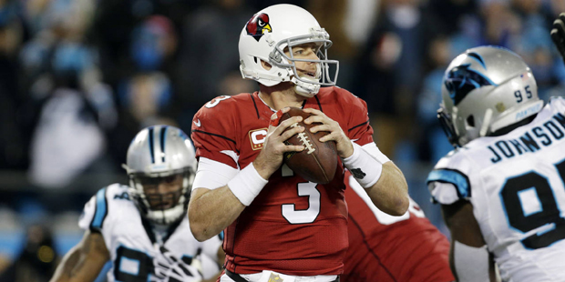Arizona Cardinals' Carson Palmer drops back during the first half the NFL football NFC Championship...