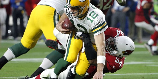 Green Bay Packers quarterback Aaron Rodgers (12) is sacked by Arizona Cardinals inside linebacker D...