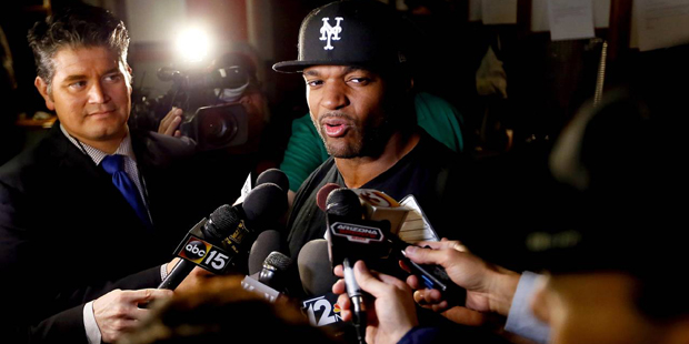 Arizona Cardinals inside linebacker Dwight Freeney talks to reporters cleaning out his locker, Mond...