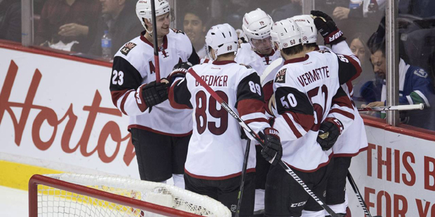 Arizona Coyotes right wing Shane Doan (19) celebrates his goal against the Vancouver Canucks with h...