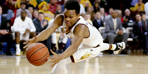 Arizona State guard Tra Holder dives for a loose ball during the first half of Arizona State's NCAA...