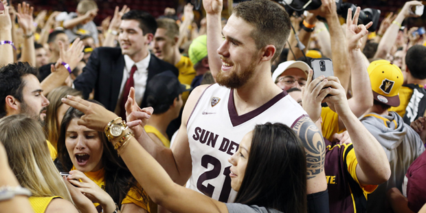 Arizona State forward Eric Jacobsen (21) celebrates with fans after defeating Arizona 81-78 during ...