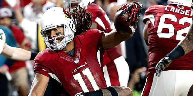 Arizona Cardinals wide receiver Larry Fitzgerald (11) scores the game winning touchdown in overtime...
