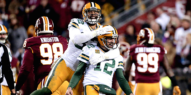 Green Bay Packers tight end Richard Rodgers (82) celebrates with quarterback Aaron Rodgers (12) aft...