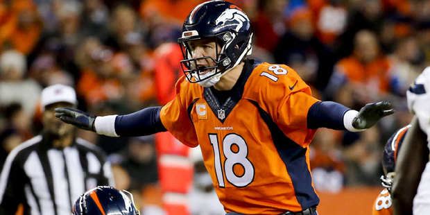 Denver Broncos quarterback Peyton Manning yells to his team during the second half in an NFL footba...