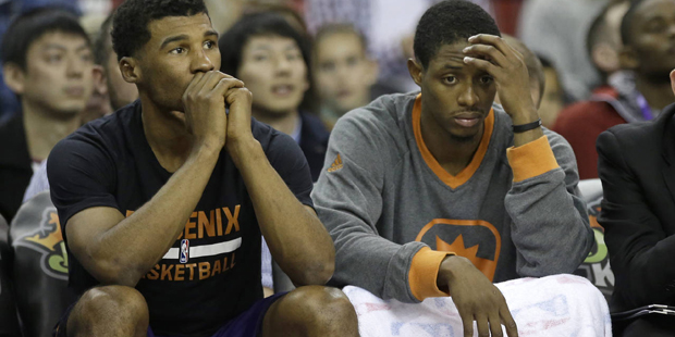 Phoenix Suns' Ronnie Price, left, and  Brandon Knight, endure the closing moments of the Suns' 142-...