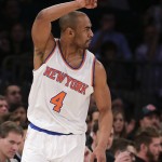 New York Knicks guard Arron Afflalo acknowledges teammates after hitting a 3-point shot against the Phoenix Suns during the first quarter of an NBA basketball game Friday, Jan. 29, 2016, in New York. (AP Photo/Julie Jacobson)