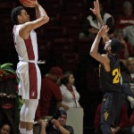 Stanford guard Dorian Pickens, left, shoots over Arizona State guard Andre Spight during the first half of an NCAA college basketball game Saturday, Jan. 23, 2016, in Stanford, Calif. (AP Photo/Marcio Jose Sanchez)