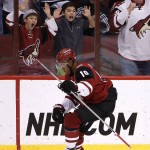 With fans cheering behind him, Arizona Coyotes' Anthony Duclair celebrates his goal against the Nashville Predators during the third period of an NHL hockey game Saturday, Jan. 9, 2016, in Glendale, Ariz. The Coyotes defeated the Predators 4-0. (AP Photo/Ross D. Franklin)