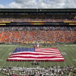 A United States flag is displayed while the fans sing the national anthem before the NFL Pro Bowl football game, Sunday, Jan. 31, 2016, in Honolulu. (AP Photo/Eugene Tanner)