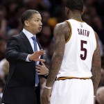 Cleveland Cavaliers coach Tyronn Lue, left, talks with J.R. Smith during the first half of an NBA basketball game against the Phoenix Suns, Wednesday, Jan. 27, 2016, in Cleveland. The Cavaliers won 115-93. (AP Photo/Tony Dejak)