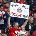 An Ohio State fan holds a sign during the first half of the Fiesta Bowl NCAA College football game against Notre Dame, Friday, Jan. 1, 2016, in Glendale, Ariz.  (AP Photo/Rick Scuteri)