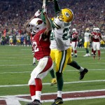 Green Bay Packers cornerback Damarious Randall (23) intercepts a pass intended for Arizona Cardinals wide receiver John Brown (12) in the end zone during the second half of an NFL divisional playoff football game, Saturday, Jan. 16, 2016, in Glendale, Ariz. (AP Photo/Rick Scuteri)