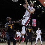 Stanford guard Dorian Pickens (11) scores over Arizona State guard Gerry Blakes (4) during the second half of an NCAA college basketball game Saturday, Jan. 23, 2016, in Stanford, Calif. Stanford won 75-73. (AP Photo/Marcio Jose Sanchez)