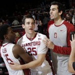 Stanford forward Rosco Allen, center, is hugged by teammates Marcus Allen (15) and Josh Sharma, right, after a 75-73 win over Arizona State in an NCAA college basketball game Saturday, Jan. 23, 2016, in Stanford, Calif. (AP Photo/Marcio Jose Sanchez)