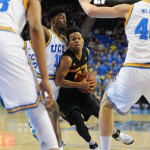 Arizona State's Tra Holder drives the key against UCLA's Jonah Bolden, from left, Isaac Hamilton and Thomas Welsh in the first half of an NCAA college basketball game in Los Angeles, Saturday, Jan. 9, 2016. (AP Photo/Michael Owen Baker)
