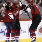 Arizona Coyotes' Anthony Duclair, middle, celebrates his goal against the Nashville Predators with Oliver Ekman-Larsson, left, and Martin Hanzal, right, during the third period of an NHL hockey game Saturday, Jan. 9, 2016, in Glendale, Ariz. The Coyotes defeated the Predators 4-0. (AP Photo/Ross D. Franklin)