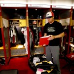 Arizona Cardinals quarterback Carson Palmer cleans out his locker, Monday, Jan. 25, 2016, in Tempe, Ariz. The Cardinals lost to the Carolina Panthers in the NFC Championship football game to end their season. (AP Photo/Matt York)